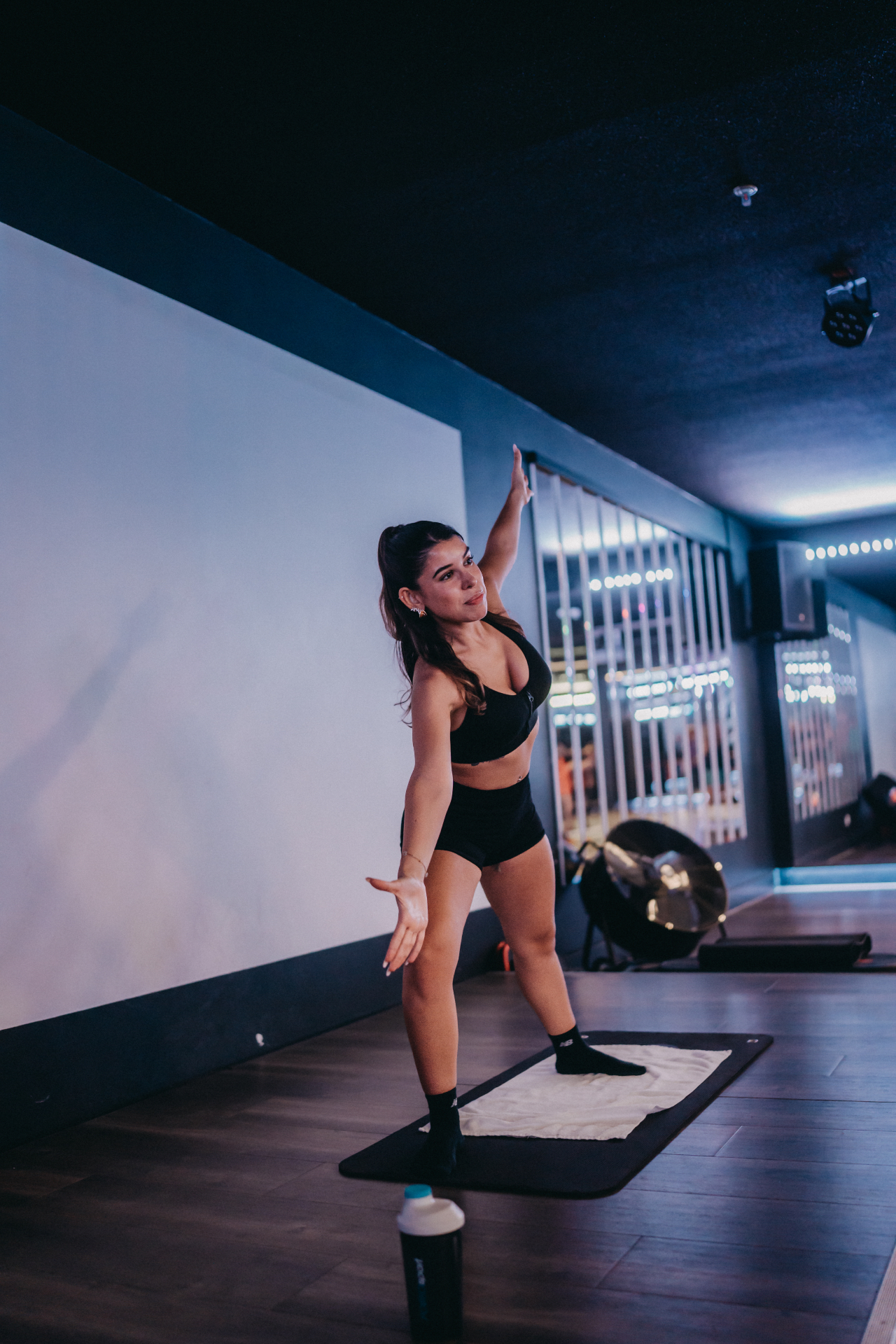 Shideh mid-movement during a dance-inspired studio class