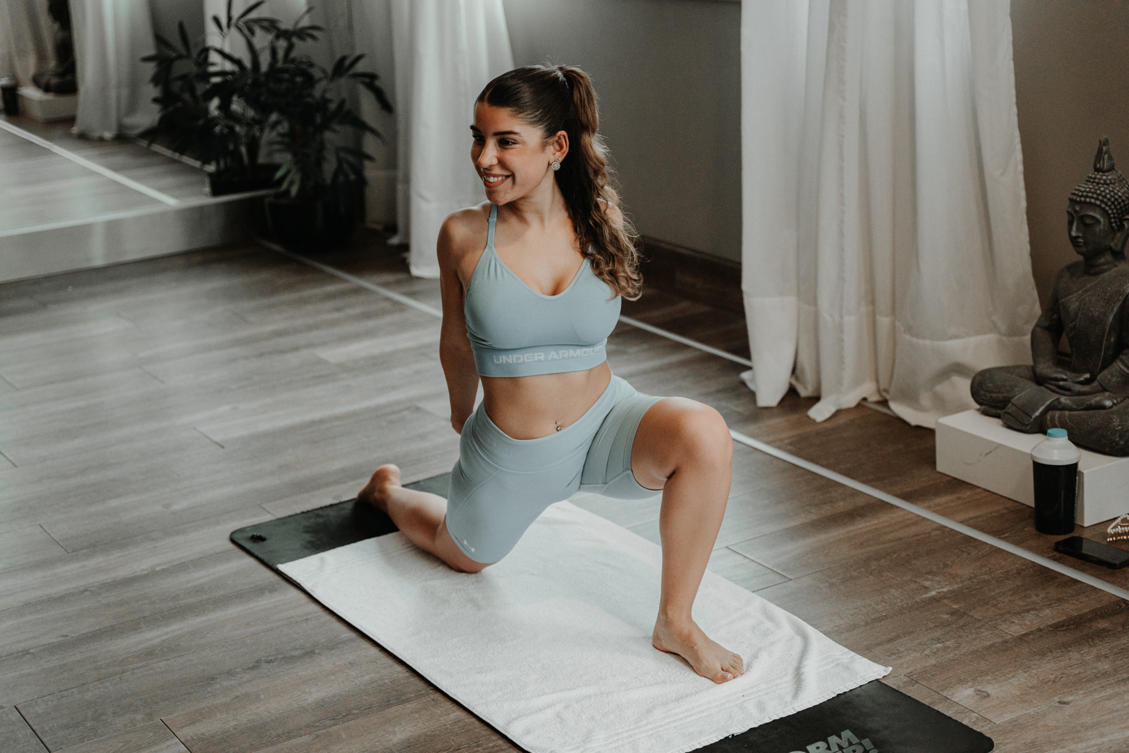 Pilates lunge stretch in a calm daylit studio